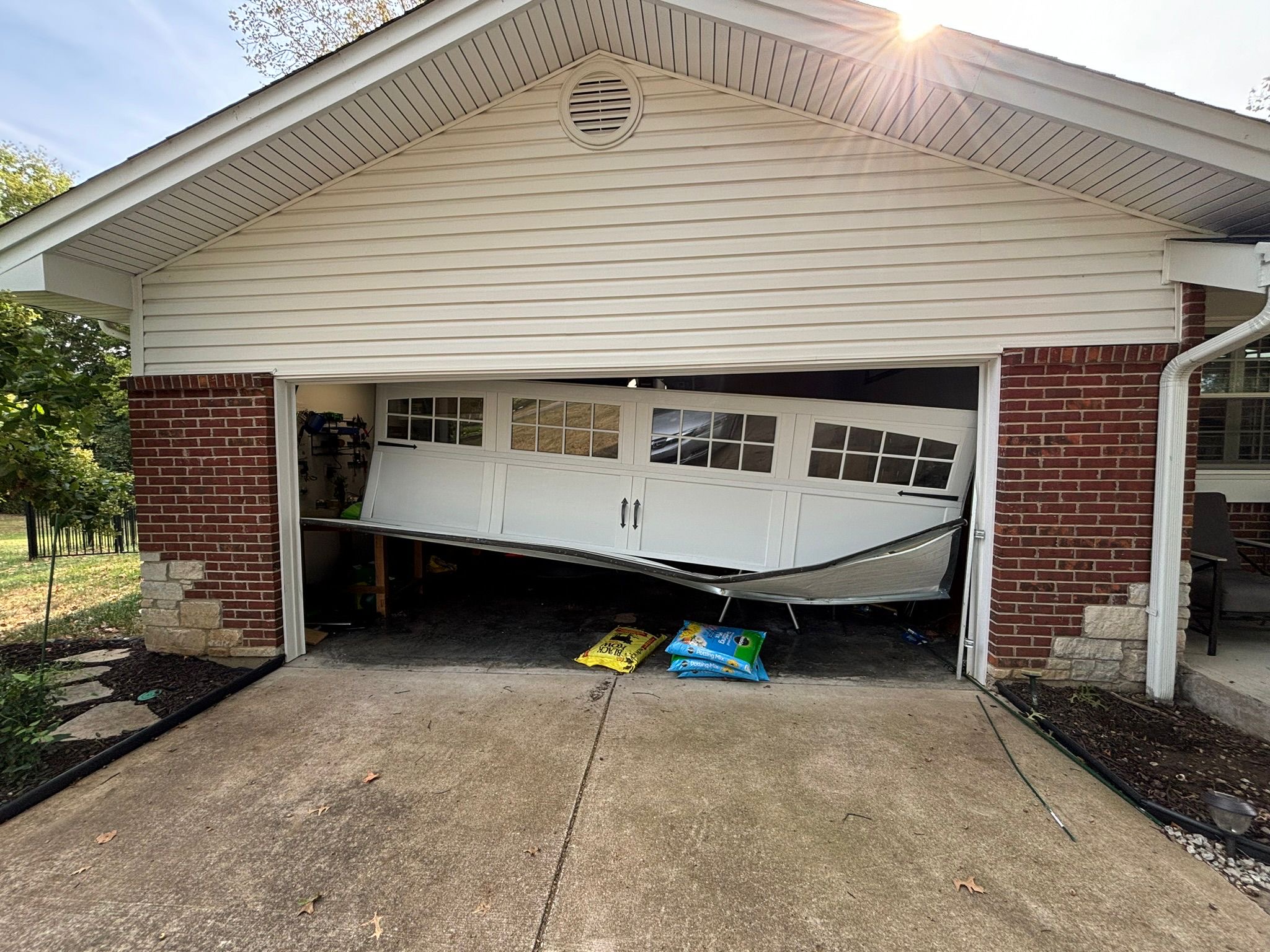 Garage door off-track and crooked