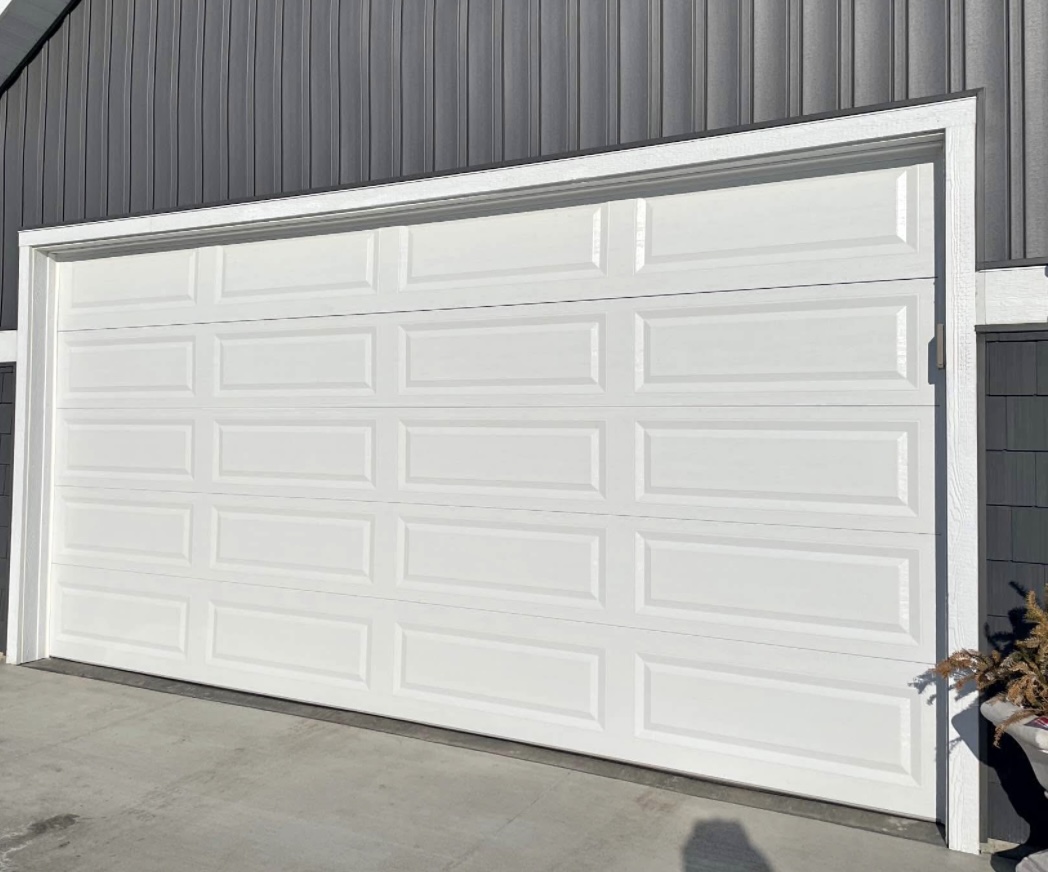 New white residential garage door installation